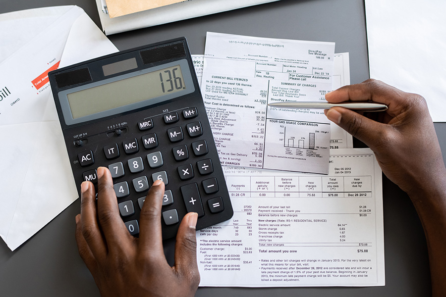 Photo of calculator and tax deduction receipts.